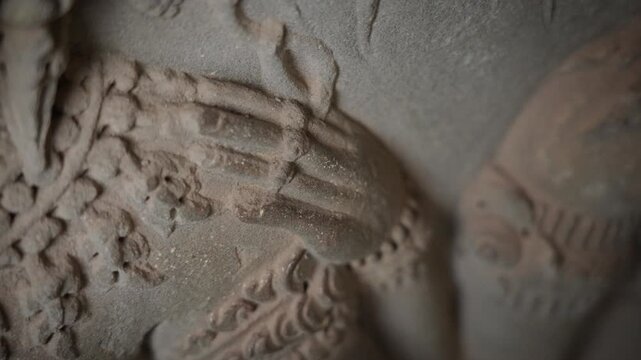 SIEM REAP, CAMBODIA - OCTOBER 27, 2025: Ancient Apsara Bas-Relief Carvings on Walls of Angkor Wat, Cambodia. Detailed 4K editorial footage  this UNESCO World Heritage Site.