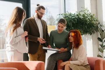 Business colleagues discussing project data meeting in office
