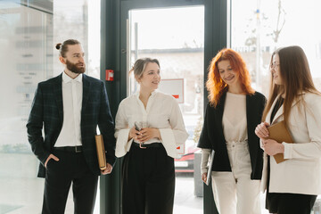 Business colleagues collaborating and discussing in modern office
