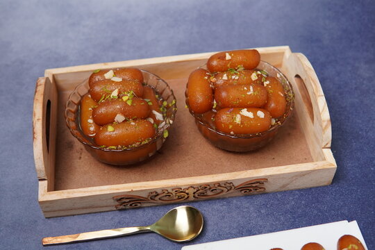 Lamba jamun is a traditional Indian sweet dessert made from milk solids, shaped into elongated forms, deep-fried, and soaked in fragrant sugar syrup. Soft, juicy, and rich in flavor, this popular swee