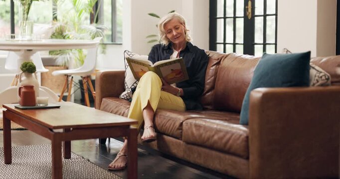 Reading, book and old woman on couch, lounge and break with smile for literature, relax and fiction. Happy, reader and senior person with novel for entertainment, knowledge and retirement in house