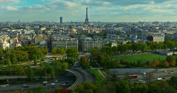 Aerial panning view of the historic center of Paris with the Eiffel Tower at summer day. Panorama of Paris from above. Aerial View on Eiffel Tower and Champ de Mars