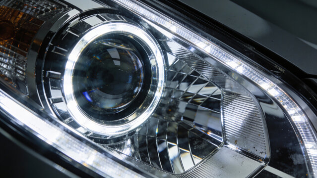 Close-up of Modern Car Headlight with Bright LED Daytime Running Light