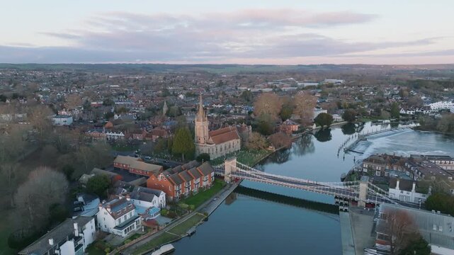 Marlow, UK Sunset High wide static over the river at sunset looking back at town.