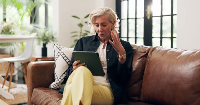Frustrated, tablet and elderly woman on sofa with problem, online issue or stress in technology. Annoyed, doubt or old person in home with internet struggle, glitch or network error on digital app.