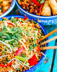 Brightly colored stir-fried noodles asian restaurant food photography