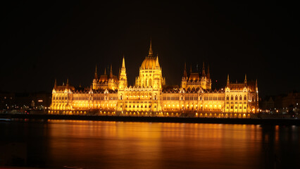 Fototapeta premium Hungarian Parliament at Night in Budapest, Hungary. From Batthyány square