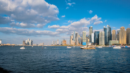 Naklejka premium Dubai Marina skyline with modern skyscrapers and waterfront view at sunset 