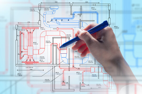 Engineering design, HVAC planning. Engineer marks ventilation and piping layout on technical blueprint, develops building systems, coordinates airflow, heating, and cooling solutions.