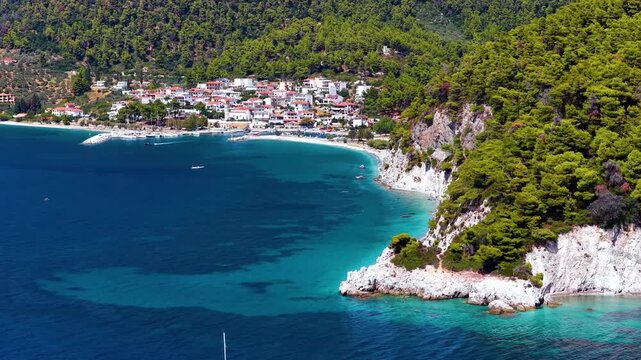 Aerial view of the beautiful coast of Skopelos island, Sporades, Greece, with the popular Hovolo beach and Neo Klima village in the background