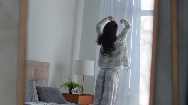 Caucasian woman awaking at home in morning getting out bed stretching girl female stretch motivated inspired awake looking window in bedroom lazy weekend reflection in mirror healthy lady wake up