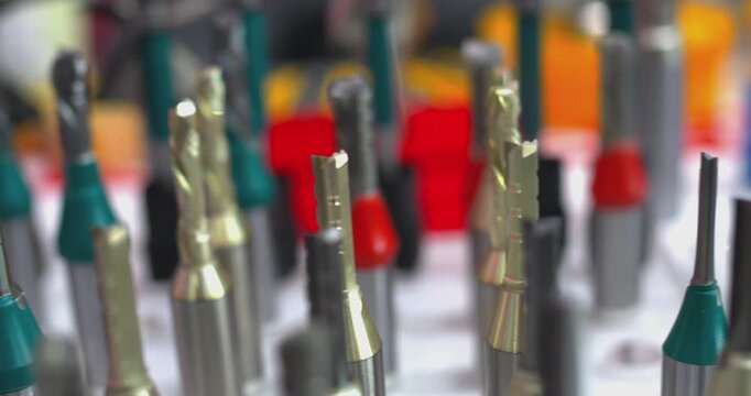 Various router bits for woodworking displayed