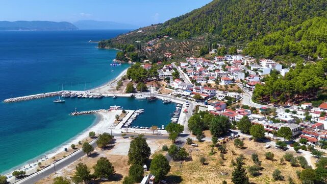 Aerial summer day view of the idyllic village, marina and beaches at Neo Klima, Skopelos island, Sporades, Greece