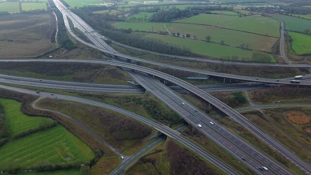 Dramatic aerial view of the M1 and M6 motorway interchange with complex traffic lanes near Rugby United Kingdom