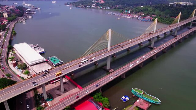 mandovi river bridge with Cruise terminal and Atal Setu bridge at panaji, goa, india. day time, semi circle shot, drone shot, 4k.