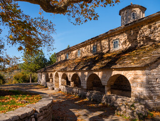 Fototapeta premium Taxiarchon church in mountain village Mikro Papigko in Mountains Epirus in Greece
