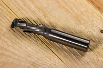 milling cutter with carbide knives. diamond coating. diamond woodworking milling cutter in close-up. carbide milling cutter. CNC tool. © AlMacro
