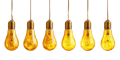 Several vintage-style light bulbs suspended against a pure black backdrop, with golden light