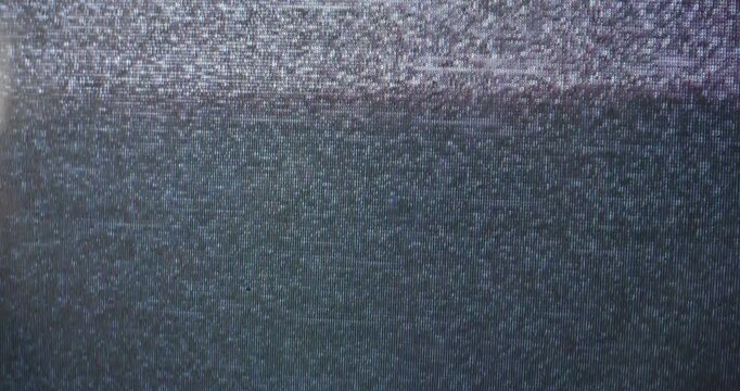 TV static noise on a vintage CRT television screen. Abstract analog background texture with no signal interference