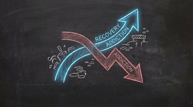 Conceptual graphic showing two arrows on chalkboard, one labeled Recovery in blue pointing upward and other labeled Addiction in red pointing downward, symbolizing overcoming challenges