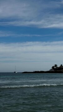 Playa del Arenal beach in Alicante, Costa Blanca coast on a sunny summer day, mountain range in the background, Spain sea and sky