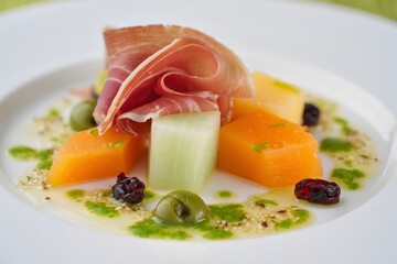Melon and Prosciutto Appetizer with Green Sauce and Garnishes