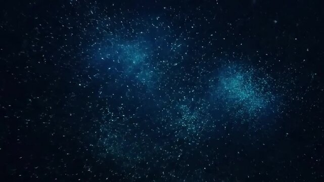 Deep Ocean Sparkle Close-up of individual bioluminescent plankton drifting with subtle currents.