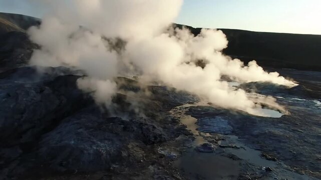 Rugged Earth's Breath A close-up shot of dense fumarole steam forcefully emanating from a vent, highlighting the raw power and texture of the volcanic rock and the swirling vapor.