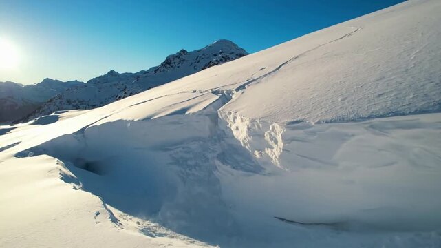 Alpine Geomorphology Capturing the natural, gravity-driven processes that slowly reshape snow-covered mountain terrain.