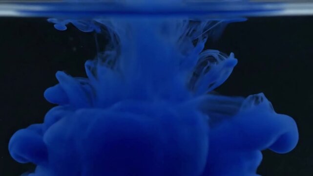 Dynamic Ink Swirls A close-up, high-speed shot capturing multiple contrasting ink colors interacting and swirling rapidly, creating intricate, intertwining patterns and delicate tendrils as they mix