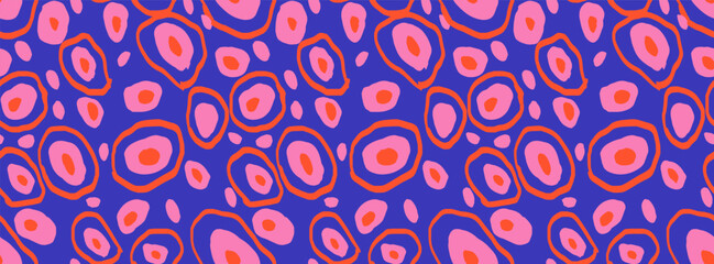 Seamless abstract pattern with irregular circular shapes in pink and orange on a deep blue background. Bold modern vector design for fabric, fashion, wrapping, or interior decor