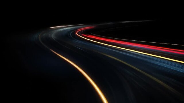 Dynamic light trails illuminate a dark, curving road, capturing the essence of speed, urban energy, and nocturnal journeys through a vibrant long exposure effect