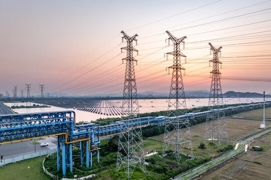 Power transmission towers at sunset