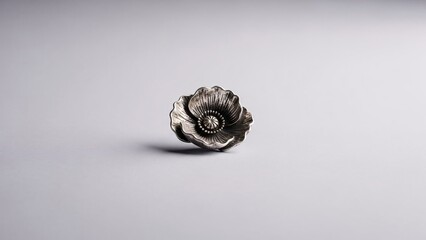 Detailed close up of an ammonite fossil on a plain gray background showcasing its spiral shell texture and natural pattern