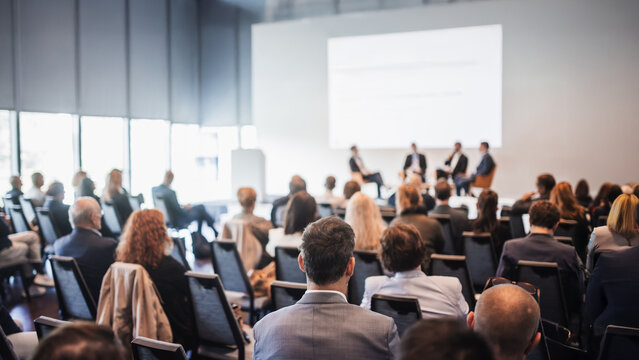 Interview and round table discussion at business convention and presentation. Audience at the conference hall. Business and entrepreneurship symposium.