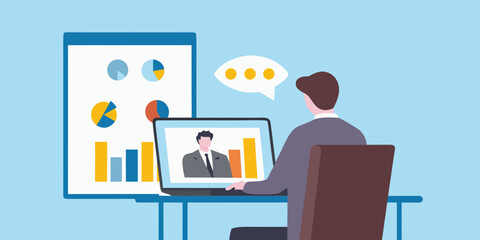 man in suit sitting at desk with laptop and large chart on wall