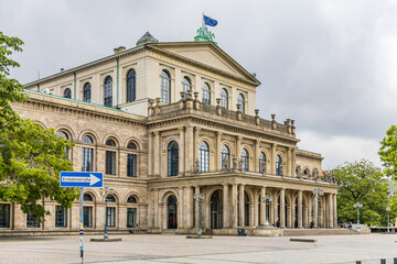 Fototapeta premium An old building with white columns and the European flag on top in the city of Hanover, Germany