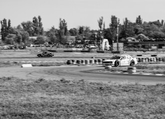 Obraz premium racing car. motorsport. circuit racing. dangerous moments on the track. high vehicle speed. sharp turn. demolition of wheels.