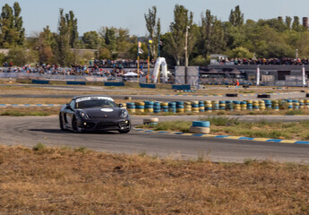 Obraz premium racing car. motorsport. circuit racing. dangerous moments on the track. high vehicle speed. sharp turn. demolition of wheels.