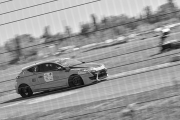 Obraz premium racing car. motorsport. circuit racing. dangerous moments on the track. high vehicle speed. sharp turn. demolition of wheels.