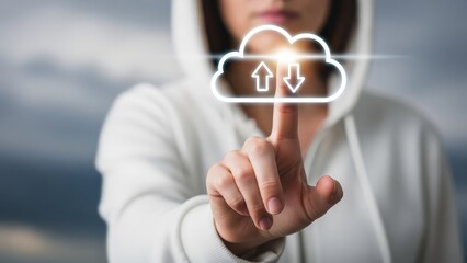 Person in a white hoodie touches a glowing cloud icon with upload and download arrows, symbolizing data transfer.