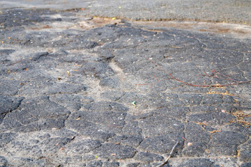 Cracked asphalt texture. Road background top view. Cracks in specialized road surface.