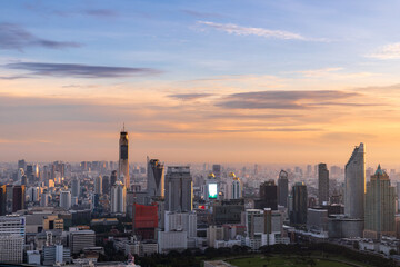 Fototapeta premium Bangkok city skyline at sunrise, modern skyscrapers, urban metropolis, Thailand