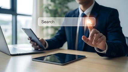 Businessman searches for information using a virtual interface while surrounded by multiple devices