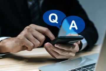 FAQ. businessman people using mobile smartphone with Q and A word icon, online customer support service, problem solving, job interview, helpdesk, solution helping, answer business concept