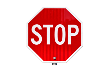Red octagonal stop sign with white text