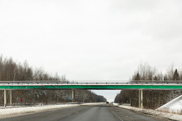 Viaduct bridge over the snowy road in winter. High quality photo