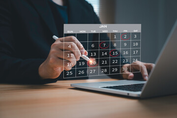 Businessman marking important dates on digital calendar represent planning schedule, deadline...