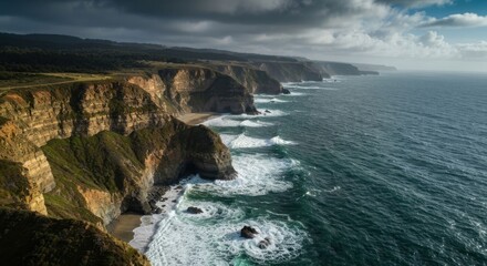 Rugged cliffs meet ocean under cloudy skies