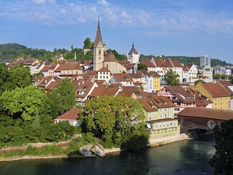 View of the old town with the parish church of the Assumption of Mary, in the back the Baden City Tower, on the right the covered wooden bridge that crosses the Limmat River, Baden, Canton, Aargau, Switzerland